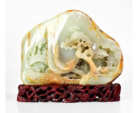 A Chinese russet and celadon coloured jade double-sided centrepiece carving, one side depicting figures on a bridge in a pago