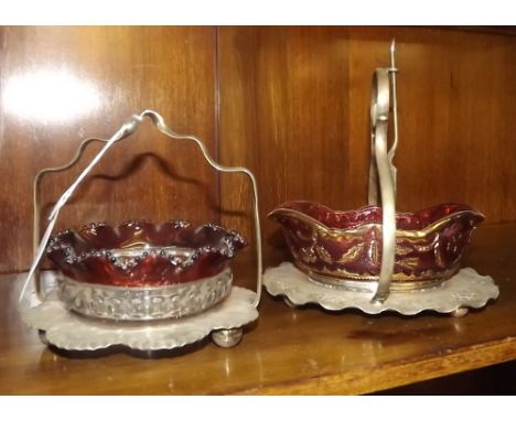 Two Victorian ruby glass jam dishes with silver plated stands. 