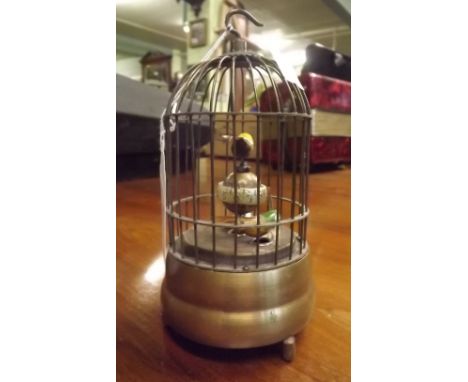 Automaton bird in a cage.