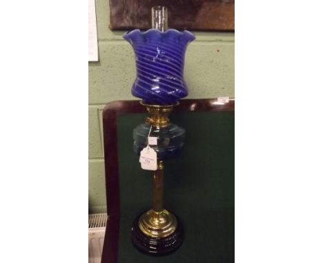 Oil lamp the brass column with blue bowl and blue tulip shade. 