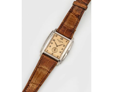 Weißgold, gest. 750. Hochrechteckiges leicht ergonomisch gewölbtes, profiliertes Uhrengehäuse, cognacfarbenes Zifferblatt mit