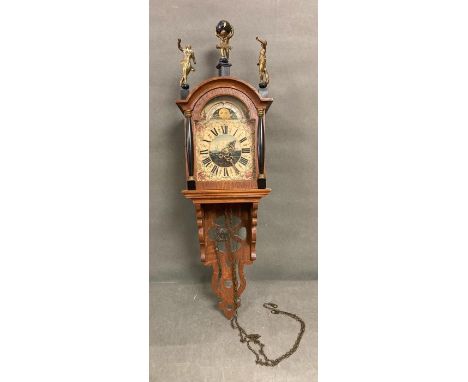 A Day/Night wall clock clock with a nautical theme.