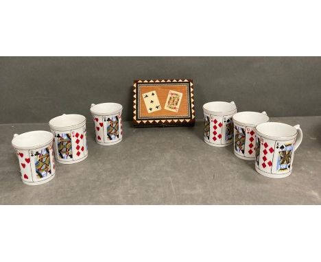 A card set and a bridge card set and six playing car mugs 
