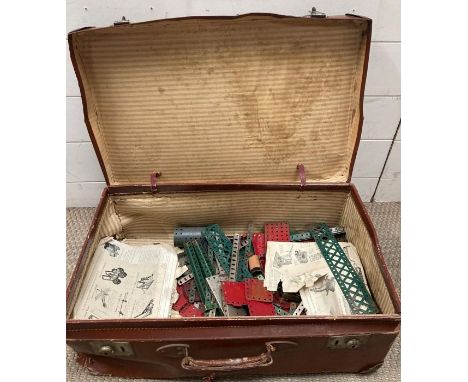 A collection of vintage Mecanno in a brown leather case 