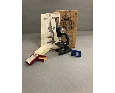 A boxed vintage students microscope 