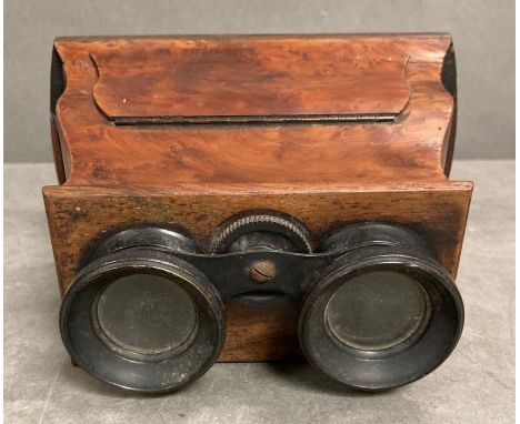 A vintage walnut stereo scope 