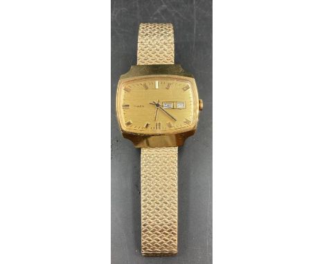 A Vintage Timex with day date on a rectangular face