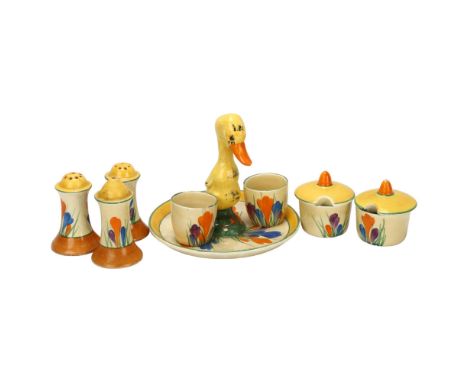 A group of Clarice Cliff Crocus pattern items, including a novelty stand with duckling handle, registered no. 741933, height 