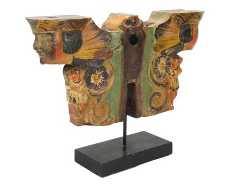 A carved and painted wood architectural moulding, with mask decoration, height 26cm, width 35cm 