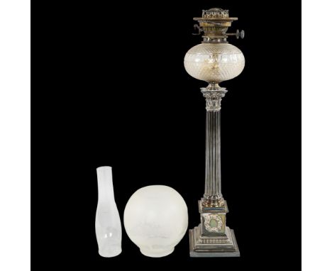 A late 19th century silver plated Corinthian column oil lamp with cut-glass well, with later shade and funnel, height of lamp