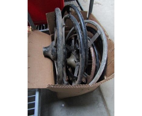 Seven assorted vintage car steering wheels 