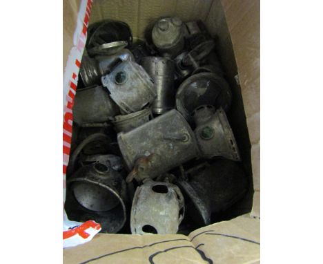 A box of mixed cycle lamp cases and parts