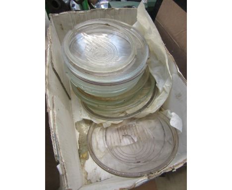 A box of assorted vintage lamp lenses