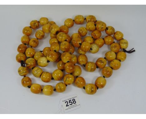 2 STRINGS OF ORIENTAL CARVED BONE PRAYER BEADS