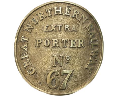 GNR porter’s armband GREAT NORTHERN RAILWAY EXTRA PORTER No67. Circular cast brass 4.5in diameter with two fixing lugs to rea