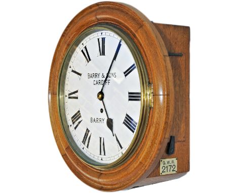 Barry Railway 12in oak cased English fusee railway clock. The case with convex and concave surround, 2 side doors and a botto