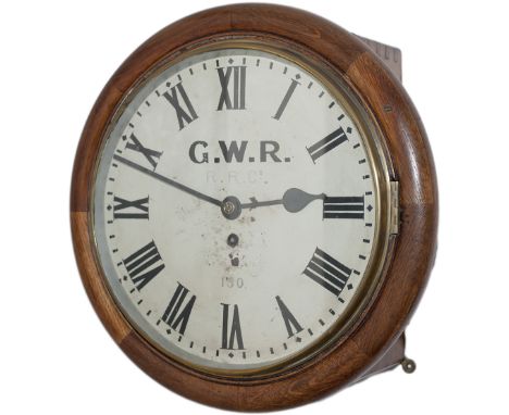 Rhymney Railway 12in oak cased English fusee railway clock. The case with convex surround, 2 side doors and a bottom door sec