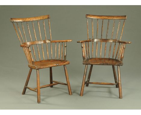 A pair of stick back Windsor armchairs, with solid seats and turned legs.  Width across arms 68 cm.  CONDITION REPORT: Height