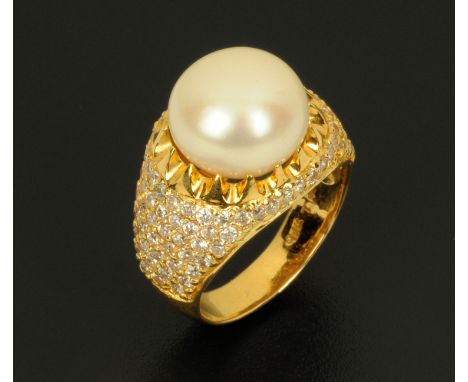 An 18 ct gold pearl and gem set ring, size O, stamped "18 k".