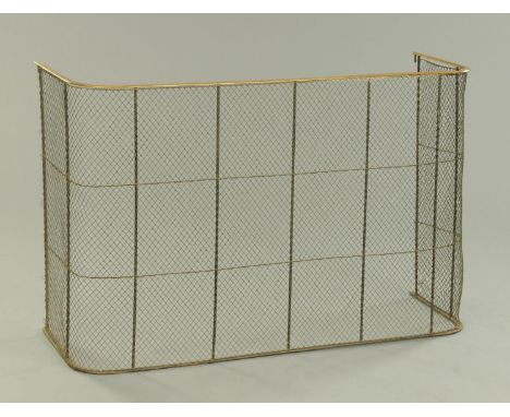 A late Victorian brass and mesh fireguard. Width 127 cm, depth 40 cm, height 82 cm. 