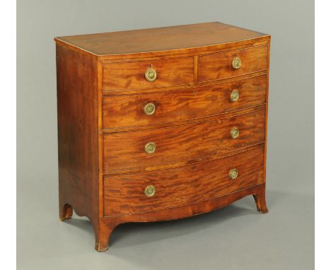 A George III mahogany crossbanded and boxwood strung bowfronted chest of drawers, with two short and three long graduated dra