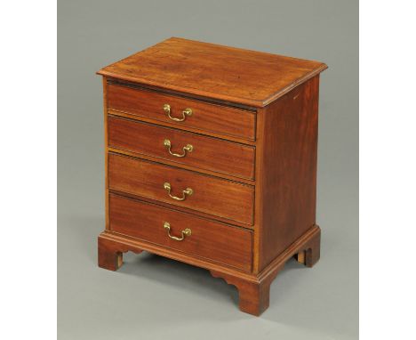 A Georgian mahogany commode chest of drawers, with four graduated drawers with brass drop handles, raised on bracket feet.  W
