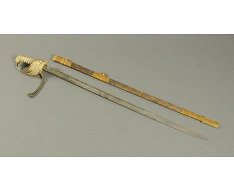 A Victorian Royal Navy Reserve sword, with leather and brass scabbard and etched blade.