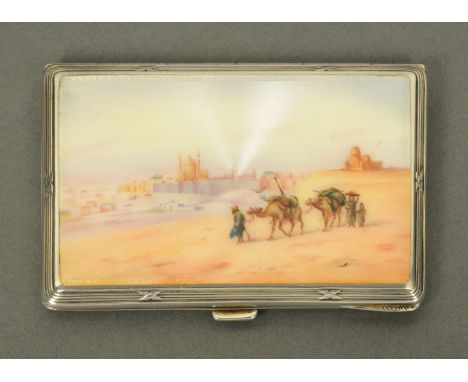 A silver cigarette case, stamped "925", engine turned and with enamelled lid depicting an Egyptian scene (see illustration). 