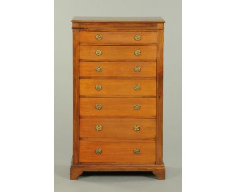 An Edwardian mahogany Wellington chest, seven drawers with brass drop handles with octagonal backplates and raised on bracket