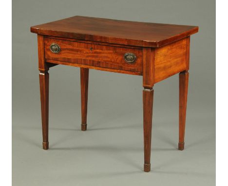 A mahogany side table, with single drawer with brass drop handles with oval backplates and raised on tapered legs of square s