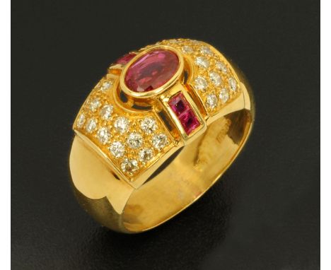 An 18 ct yellow gold oval ruby ring, with pavé diamond surround, size M.