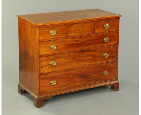 A late Georgian mahogany chest of drawers, with crossbanded boxwood strung edge above three short and three long graduated dr