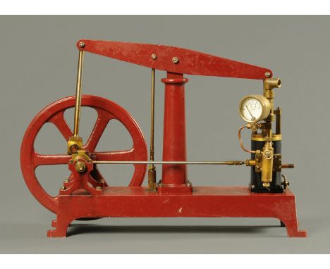 A beam engine, with 60 lbs per square inch pressure gauge, 8 inch fly wheel.  Height 11 ins to top of beam, length 17.5 ins (