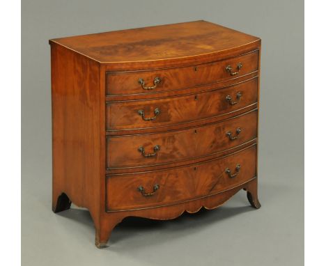 A late Victorian mahogany bowfronted chest of drawers, being boxwood and ebony strung, with caddy top, four drawers with bras