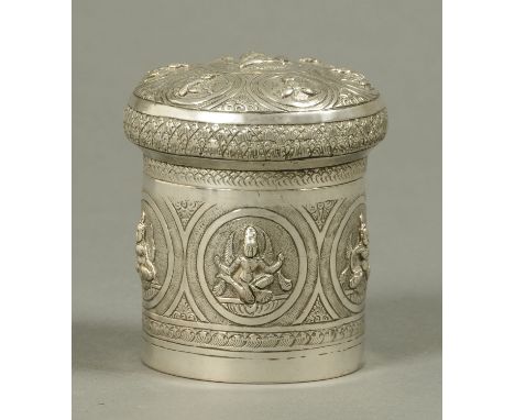 An Indian silver tea caddy, lidded, embossed with Deities.  Height 9.5 cm. 