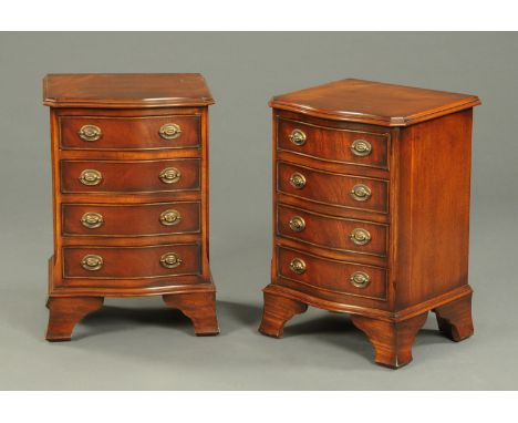 A pair of reproduction mahogany serpentine fronted chests of drawers, raised on bracket feet.  Width 41 cm. 