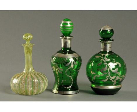 Two green glass silver lustre decorated decanters, and an Italian decanter (AF).  Tallest 23 cm. 