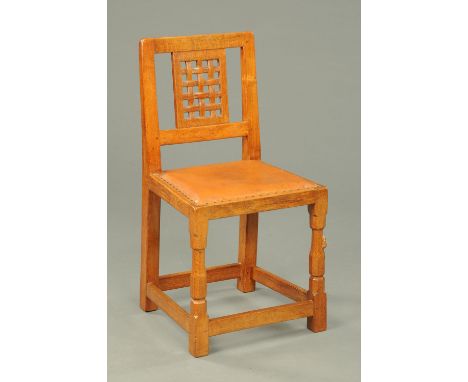 A set of four Mouseman Thompson of Kilburn lattice backed dining chairs.  PROVENANCE - Purchased from Robert Thompson in 1953