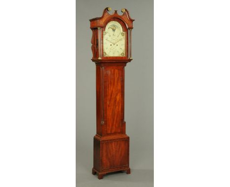 An early 19th century mahogany longcase clock, with swans neck pediment with blind fretwork above the arched glazed door encl