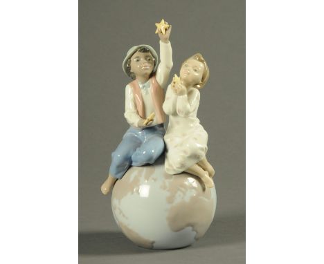 A Lladro figure group, "A World of Love", Serial No. 06353, with original packaging.  Height 26 cm.  CONDITION REPORT: This l