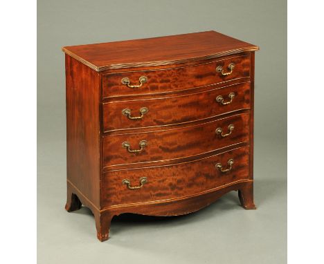 An Edwardian mahogany serpentine fronted chest of drawers, with moulded edge above four long graduated drawers with brass dro
