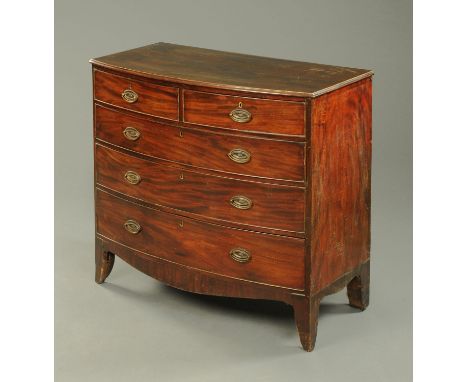 A 19th century mahogany bowfronted chest of drawers, with two short and three long graduated drawers with brass drop handles 