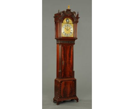 A George III mahogany longcase clock, by Payne, Blenheim, with blind fret carved pediment, arched dial with Father Time autom