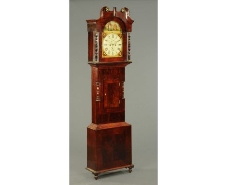 A Victorian mahogany longcase clock, with swans neck pediment above the arched glazed door enclosing the painted dial and two