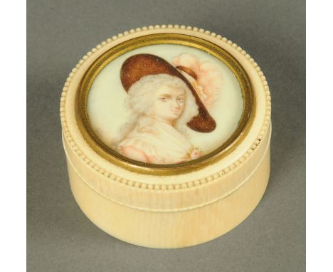 A late 19th/early 20th century cylindrical lidded casket, ivory, with portrait miniature to lid.  Diameter 68 mm. 