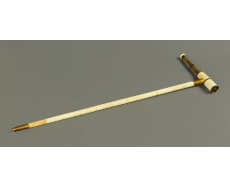 A brass and bone combined walking stick and telescope.  Height 91 cm (see illustration). 