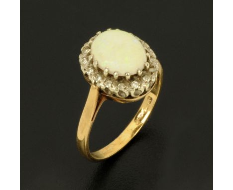 A 9 ct gold opal and diamond set ring, size M.