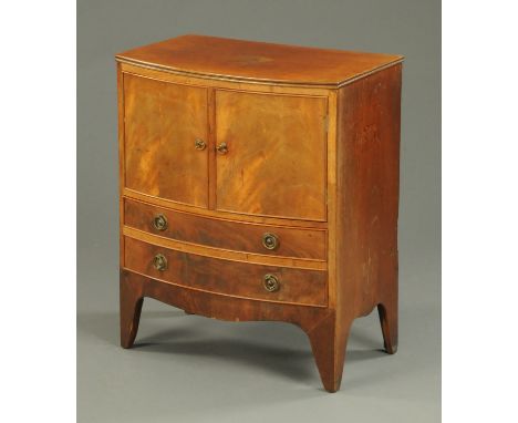 A George III mahogany bowfronted bedside commode cabinet, converted to a cupboard and drawer (modelled as two) and raised on 