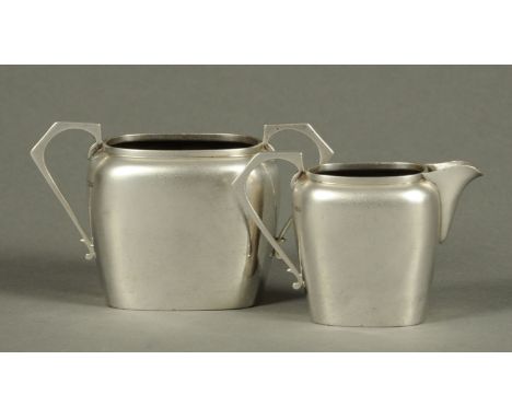 A silver sugar basin and cream jug, Birmingham 1929, 264 grams. 