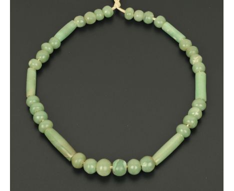 A jade necklace.  Length 48 cm. 